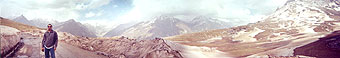 Devinder at Rohtang Pass. got this panoramic view by click 7 pics standing in one place and turning a bit, clicking, turning, clicking...